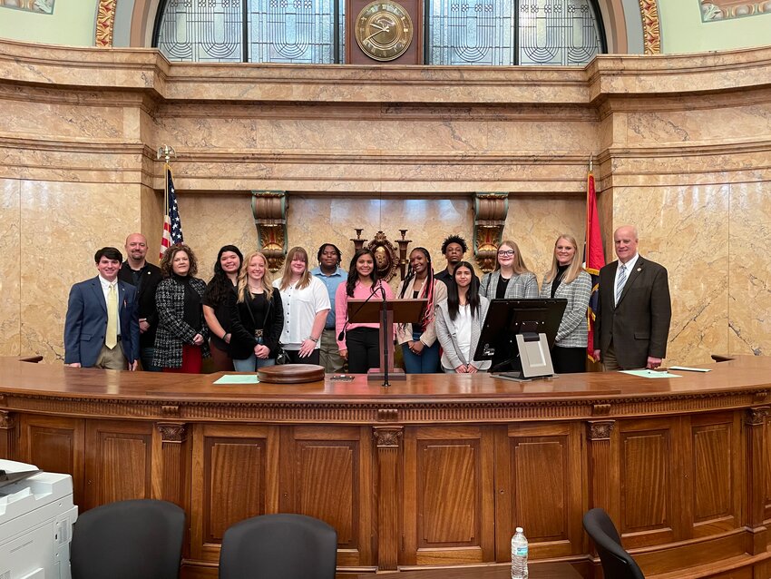 Pictured are, from left, Former LPS student Ty Martin, LPS Instructor Brade Edmondson, Former LPS instructor Delana Waddell, Cianna Phillips, Lucy Ray, Brianna Martin, Noah Beamon, Jaliyah Lewis, Trinity Towner, Erick Spivey, Eriane Dan, Victoria Clements, PNCCTC Director Lacie Flake, and State Representative Scott Bounds.